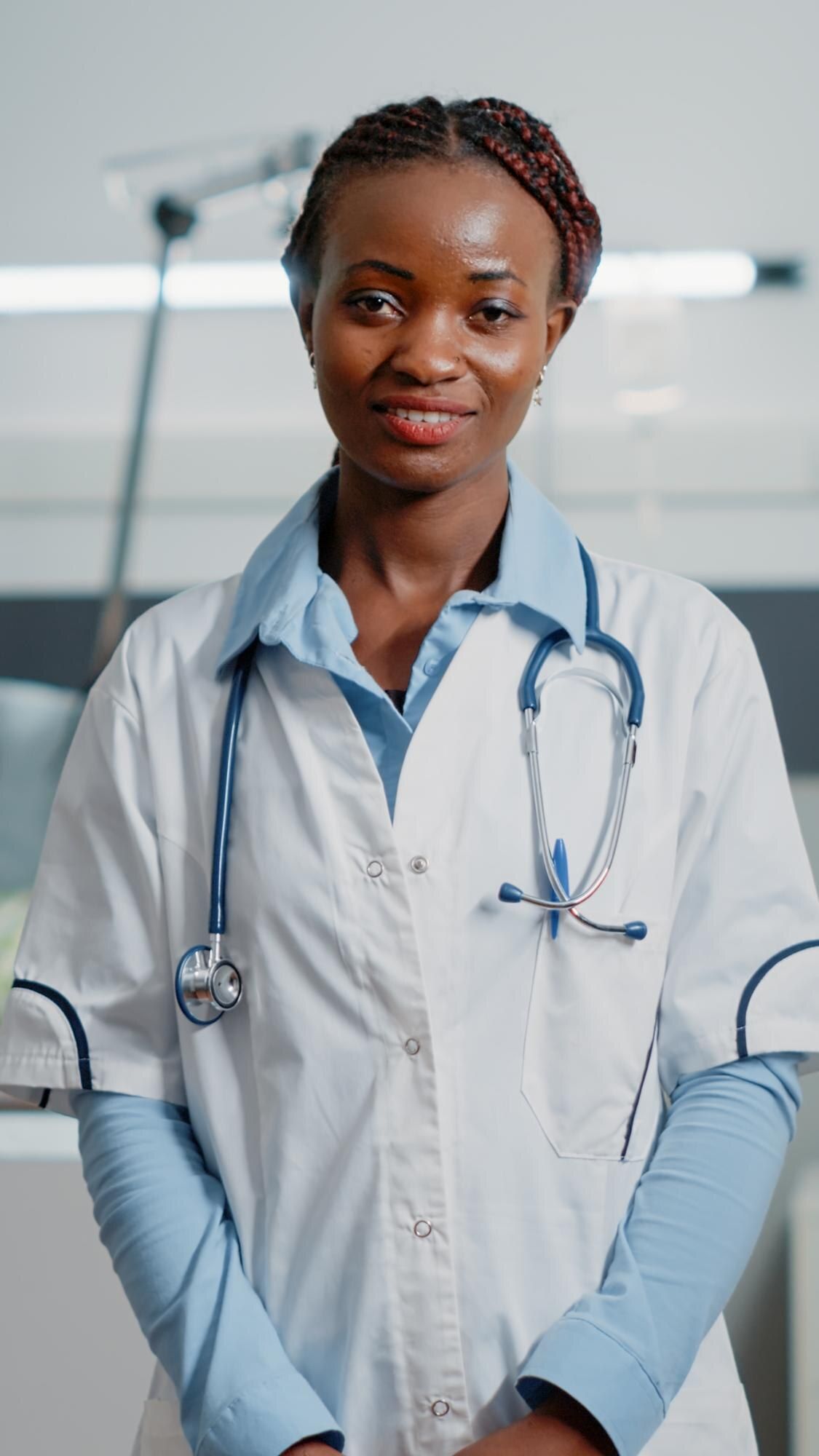 Portrait of an African doctor with a stethoscope in a hospital ward