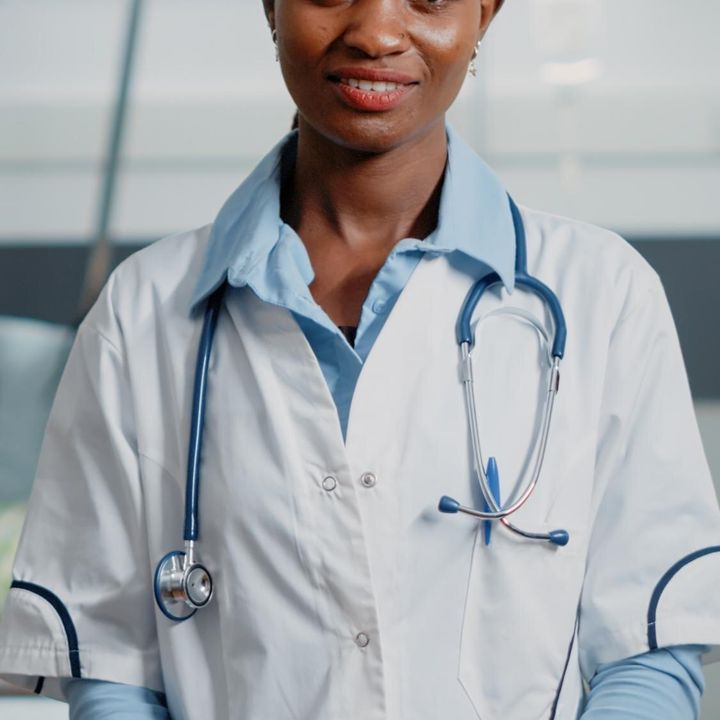 Portrait of an African doctor with a stethoscope in a hospital ward