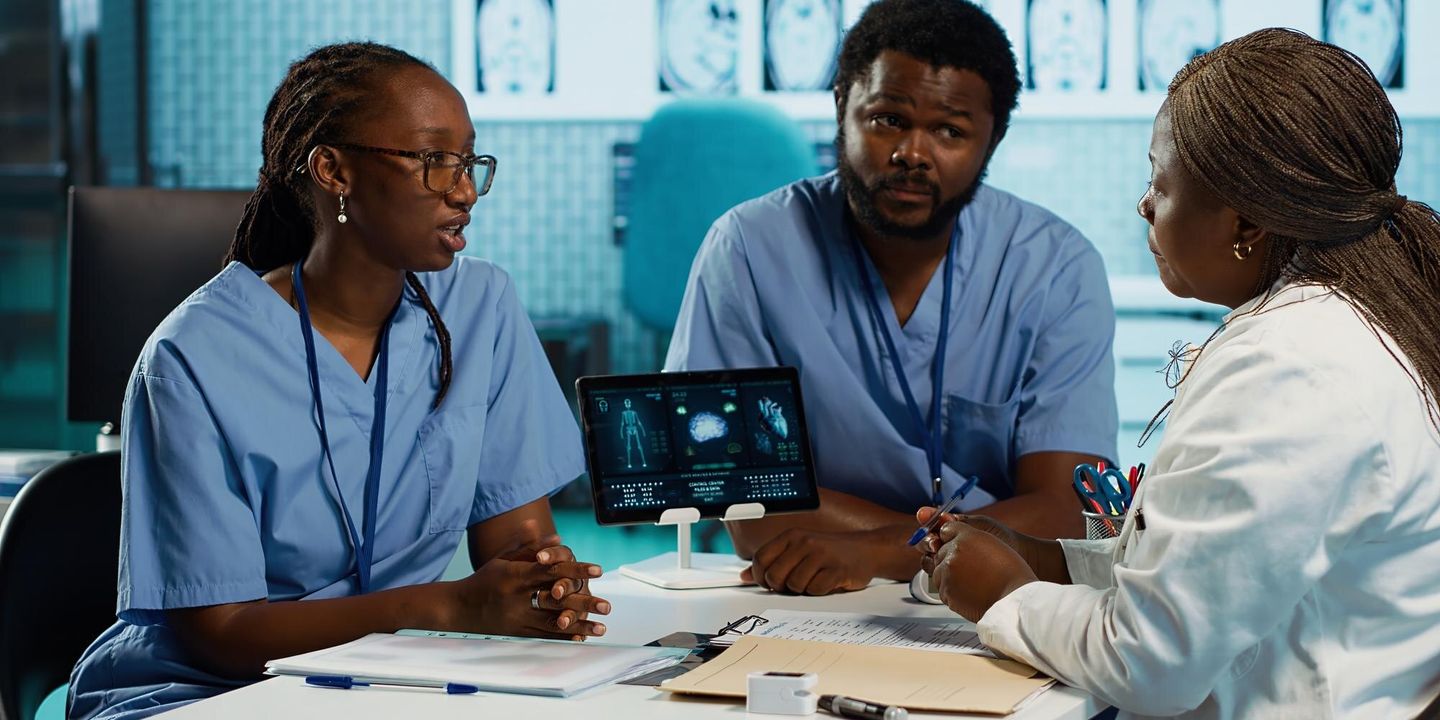 African clinicians in a leadership discussion at a hospital
