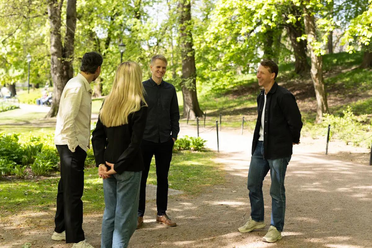 Team members collaborating outdoors