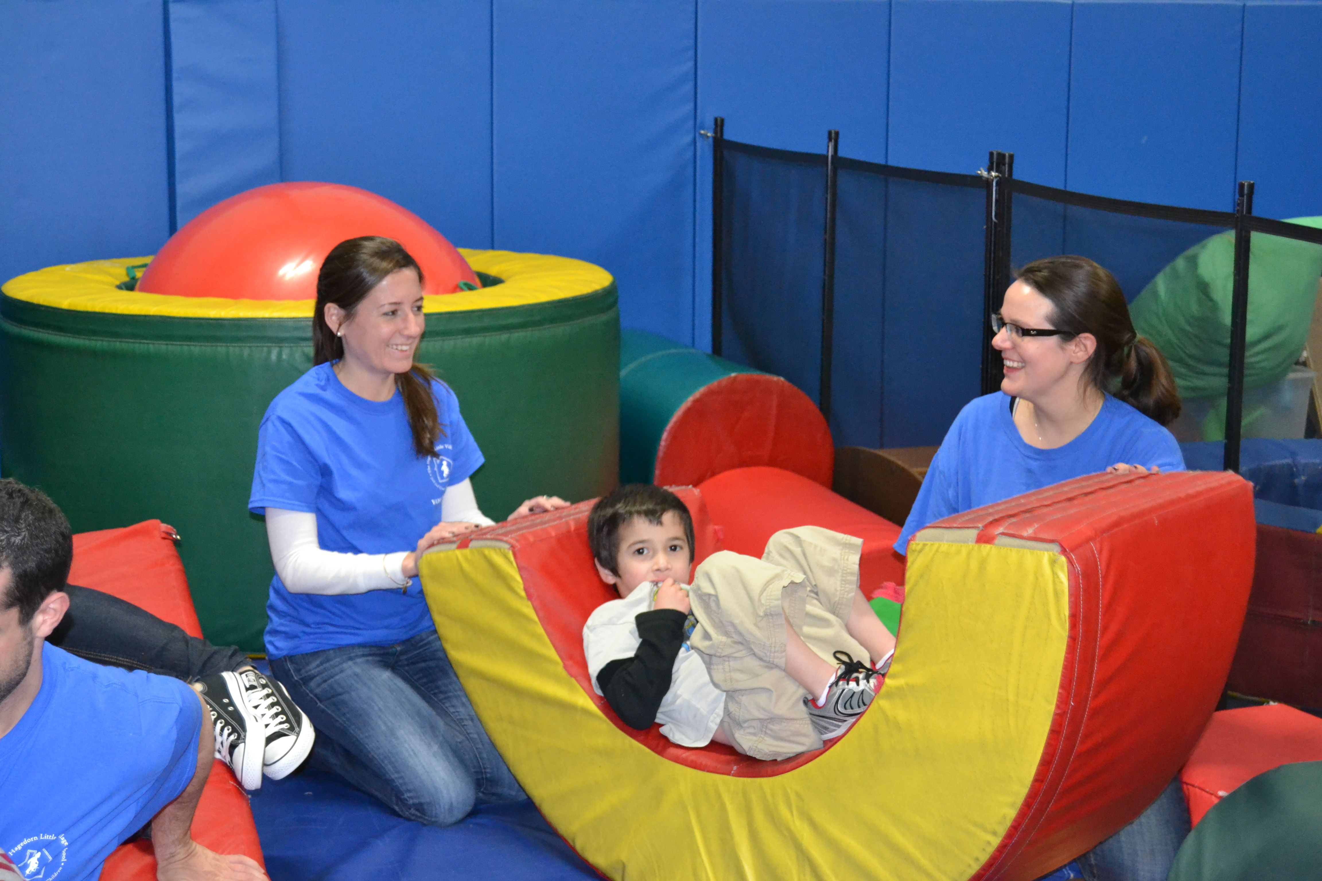 children and staff in the soft gym