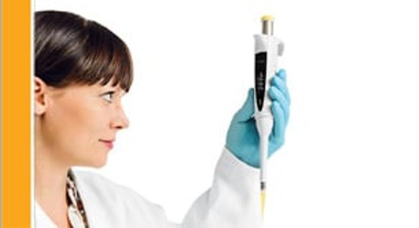 Research scientist holding a pipette