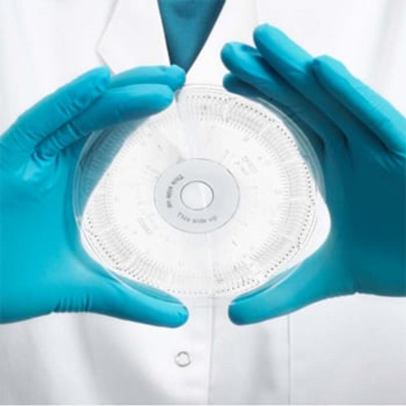 Image of an immunoassay scientist holding a Gyrolab Bioaffity CD