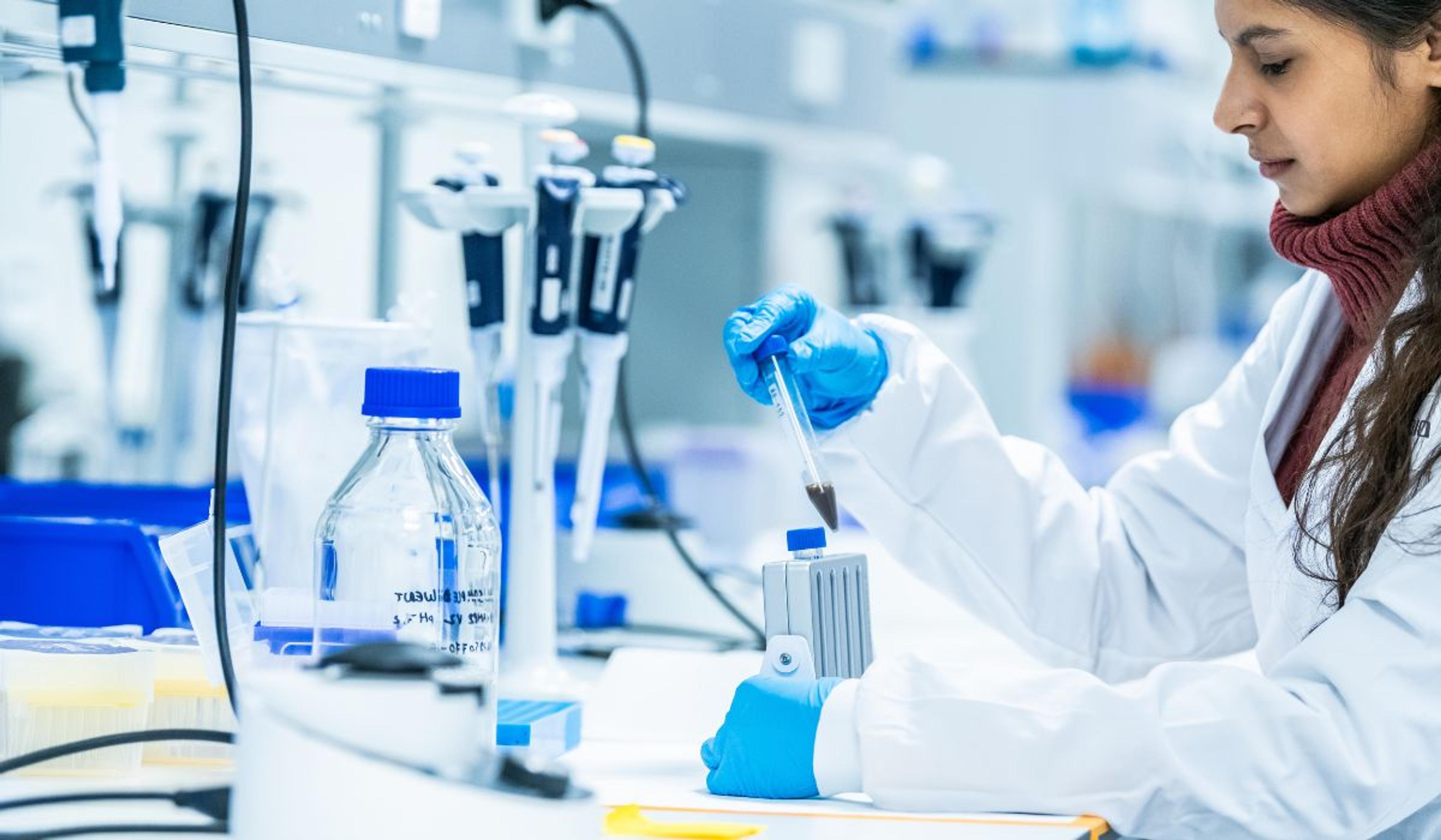 Lab technician experimenting in lab