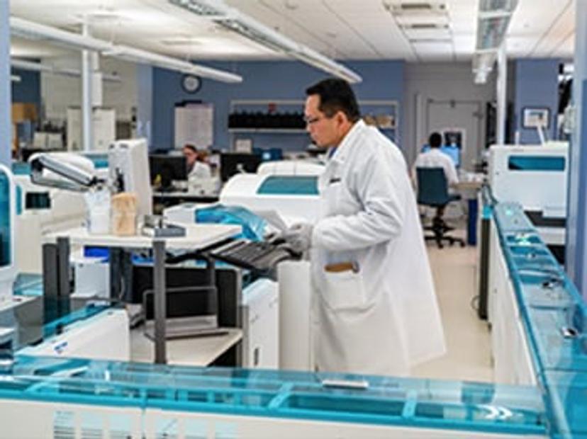 Scientist in a lab using a mass spectrometer for the development of methods for measuring biomarkers in biological fluids