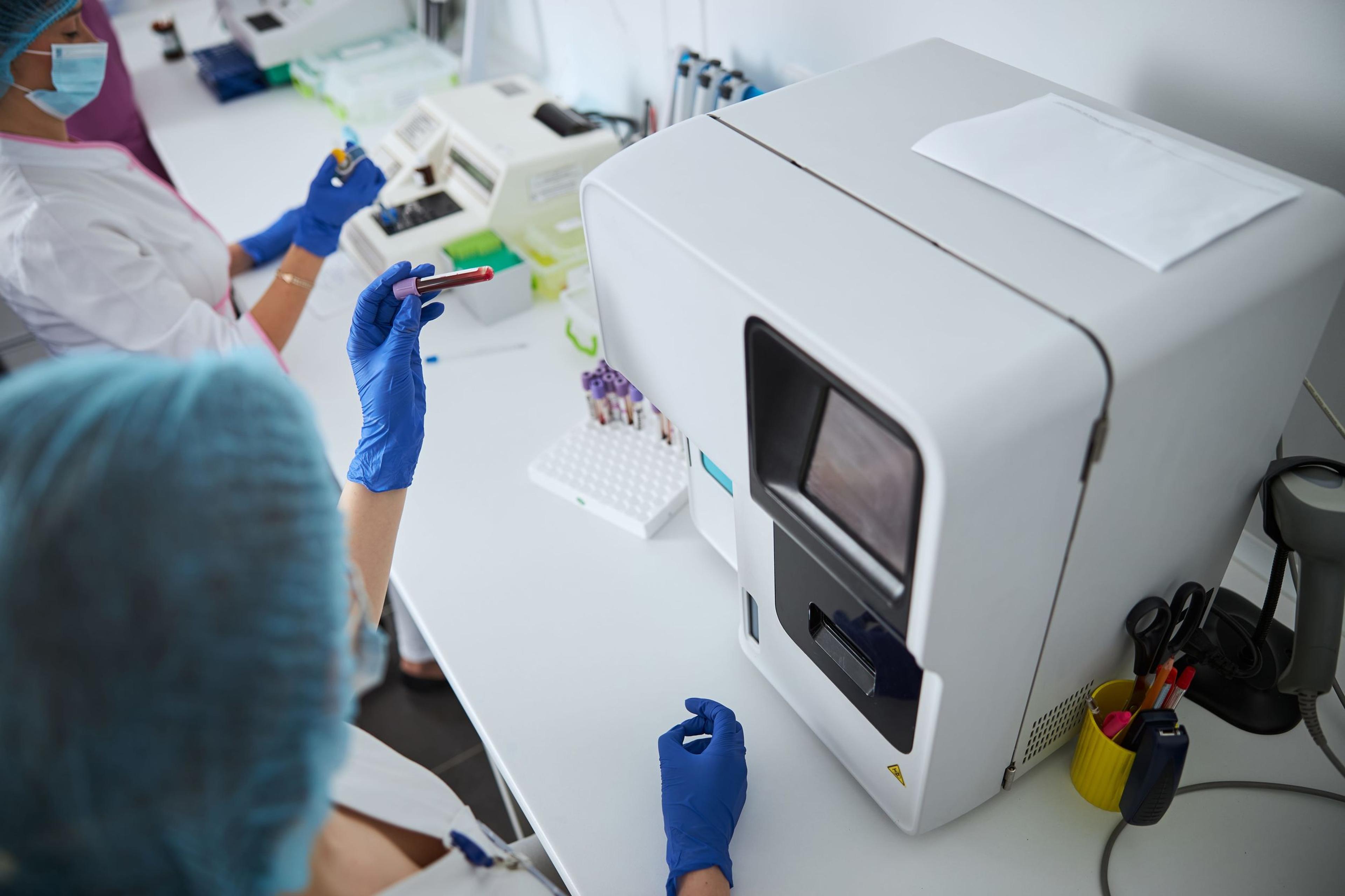 Experienced lab worker performing a complete blood count