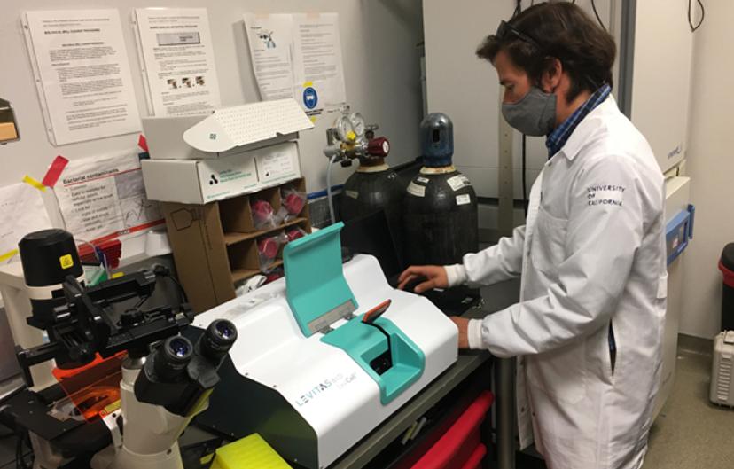 Photo of Dr. Diaz-Flores in the lab using the LeviCell system