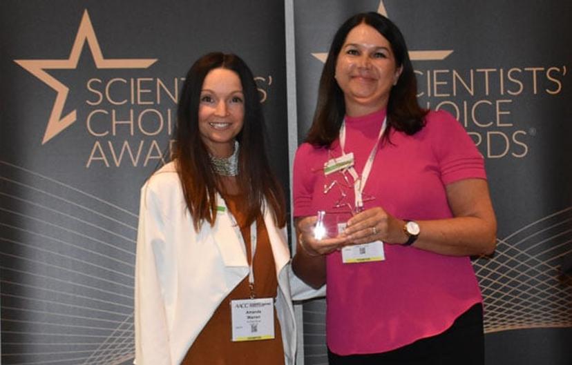 Dianna Poissant & Amanda Warren collect award on behalf of ELITechGroup