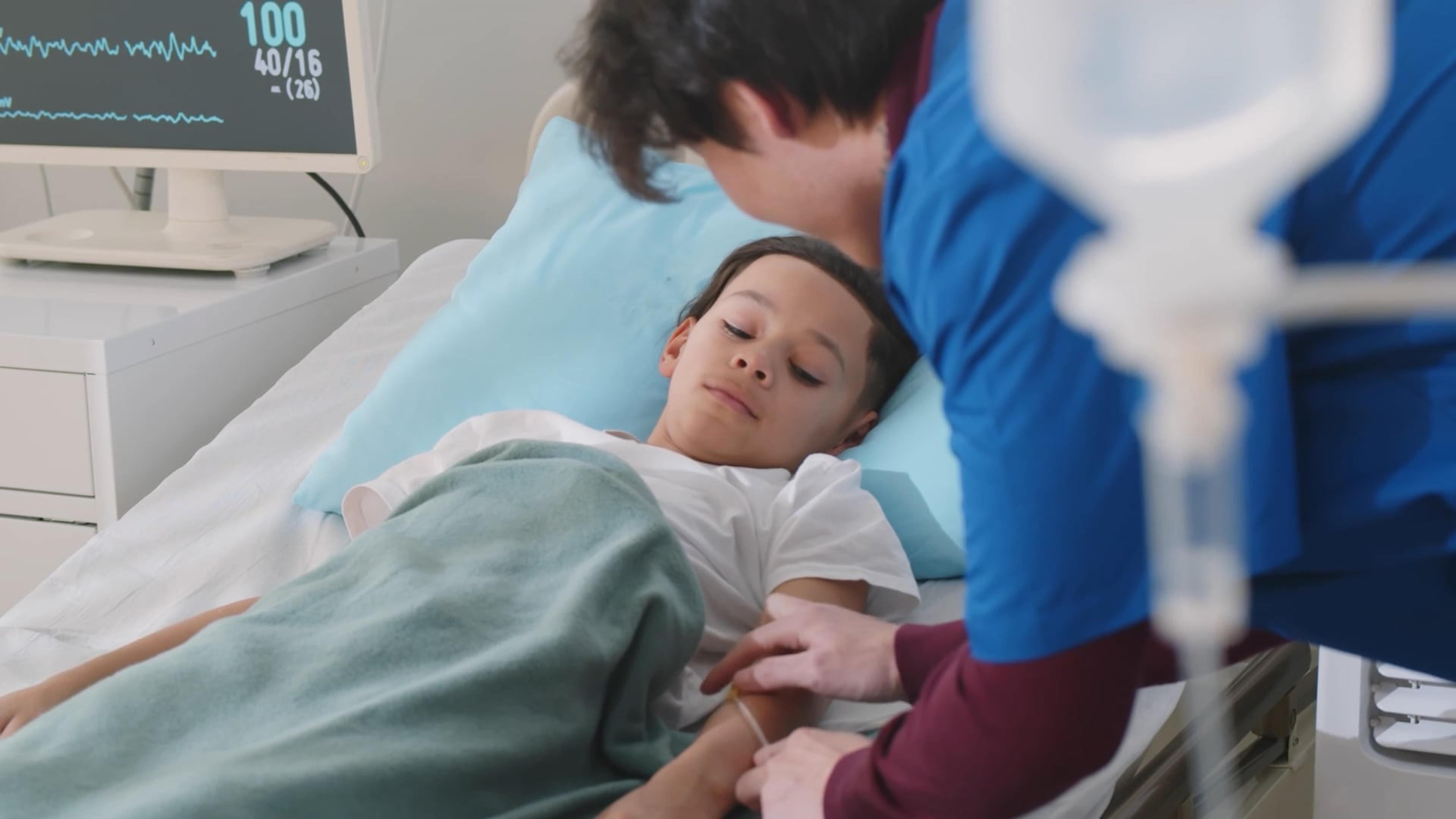 A patient in a bed receiving sepsis treatment