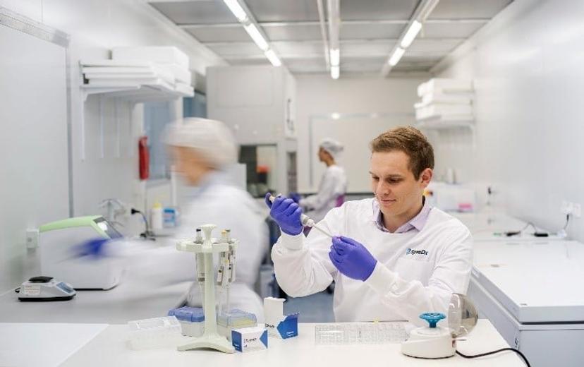 Scientist with a pipette in his hand