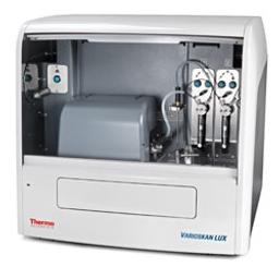 Varioskan LUX with front open showing dispensers and modules