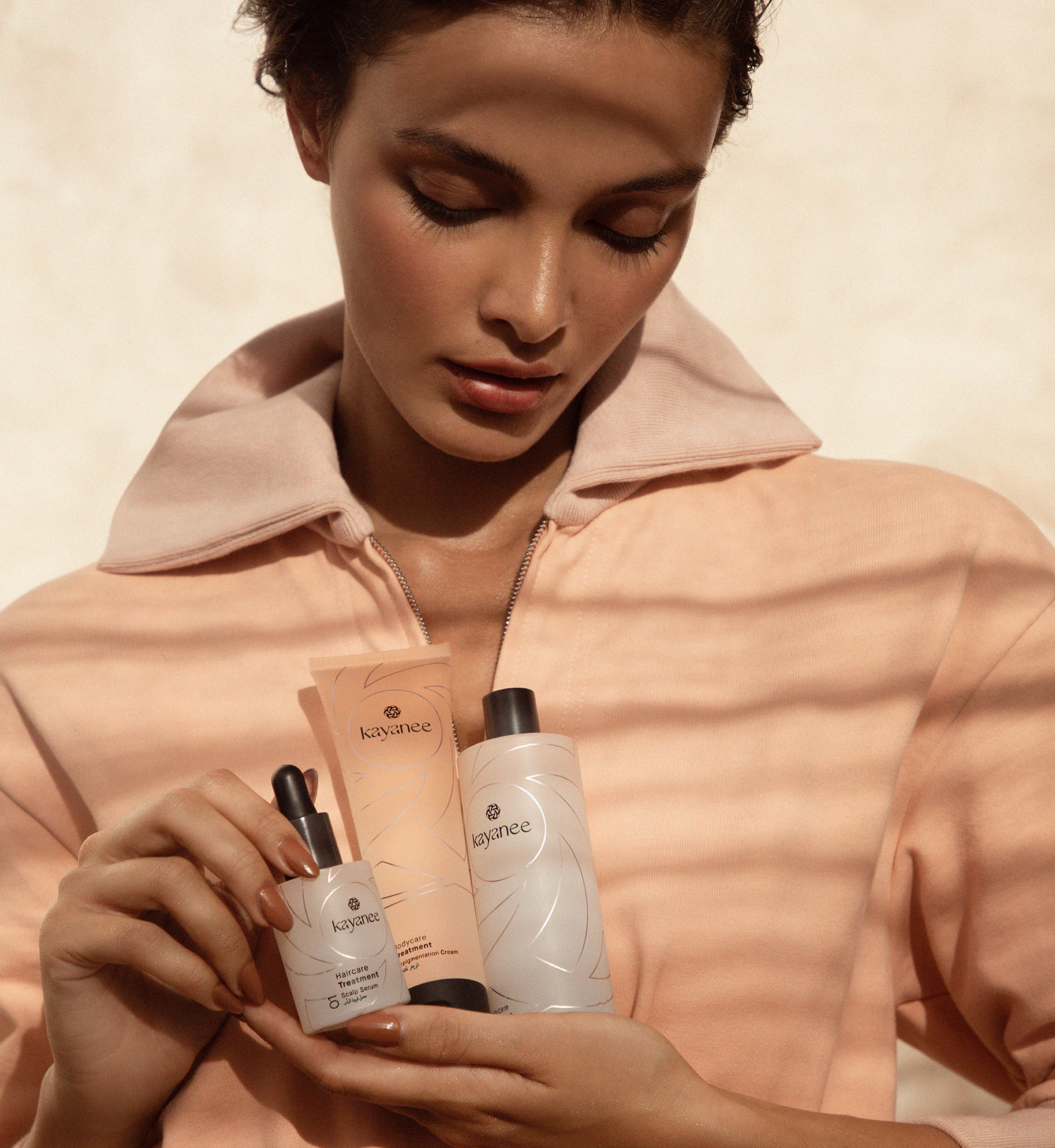 Model holding Kayanee products