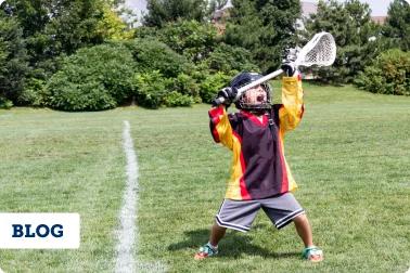 Youth male athlete playing Lacrosse