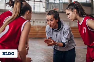 Female coach encouraging her team