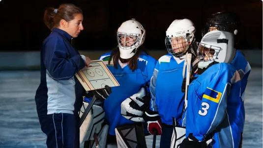 Ice Hockey coach talking with her team