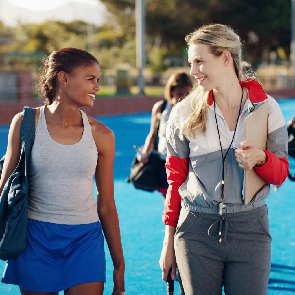 Female coach talking with an athlete