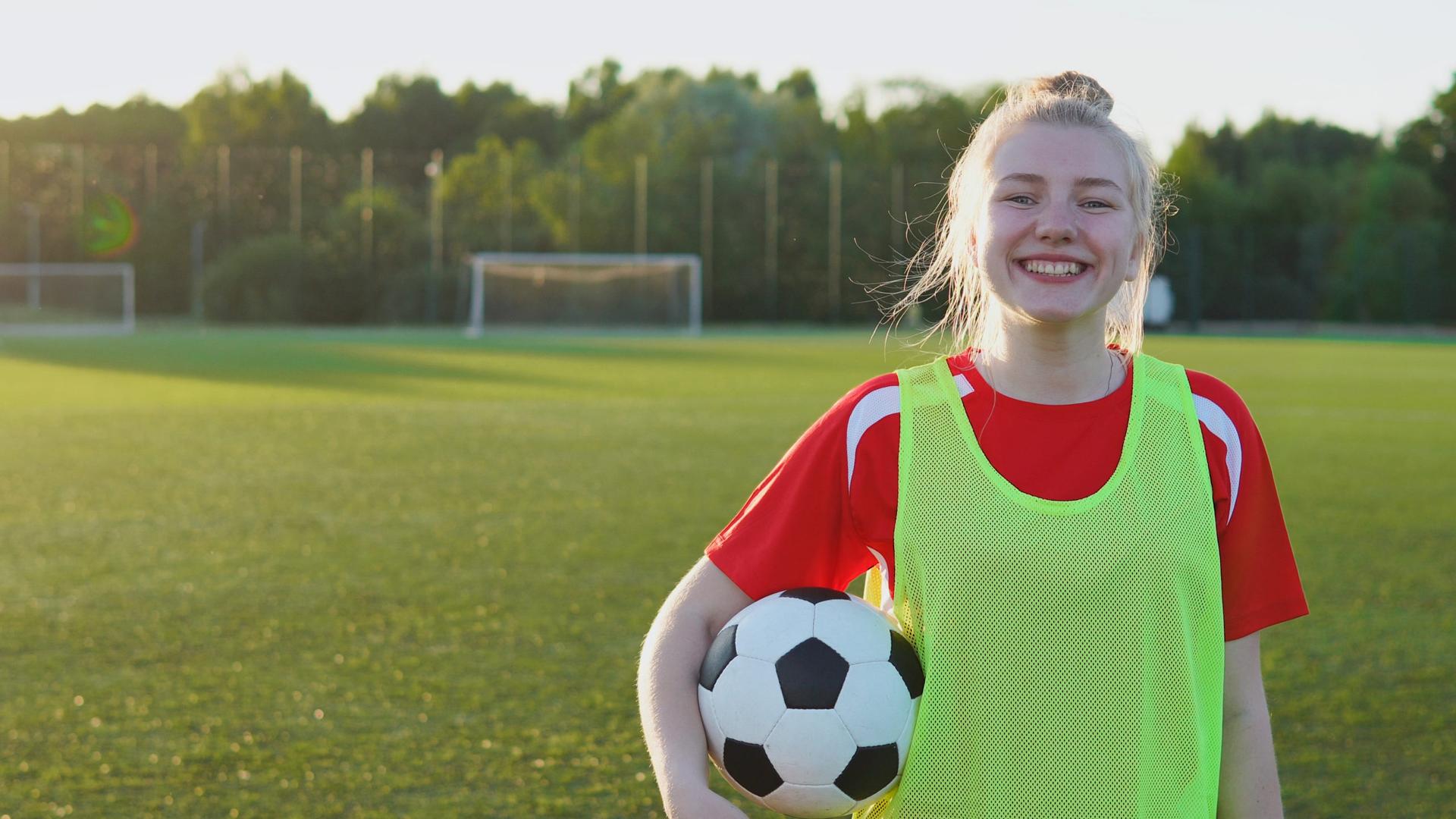 Teenage girl playing soccer