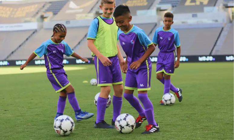 Youth athletes playing soccer