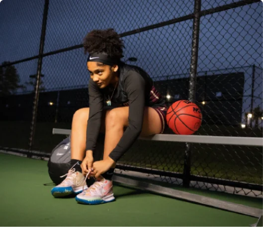 Basketball girl doing up her laces