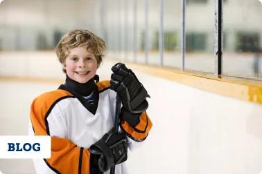 Male youth athlete playing ice hockey