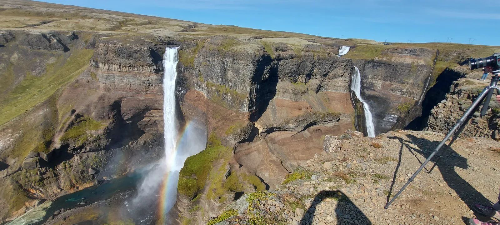 Dramatic waterfalls with a vibrant rainbow in the Fjallabak Nature Reserve