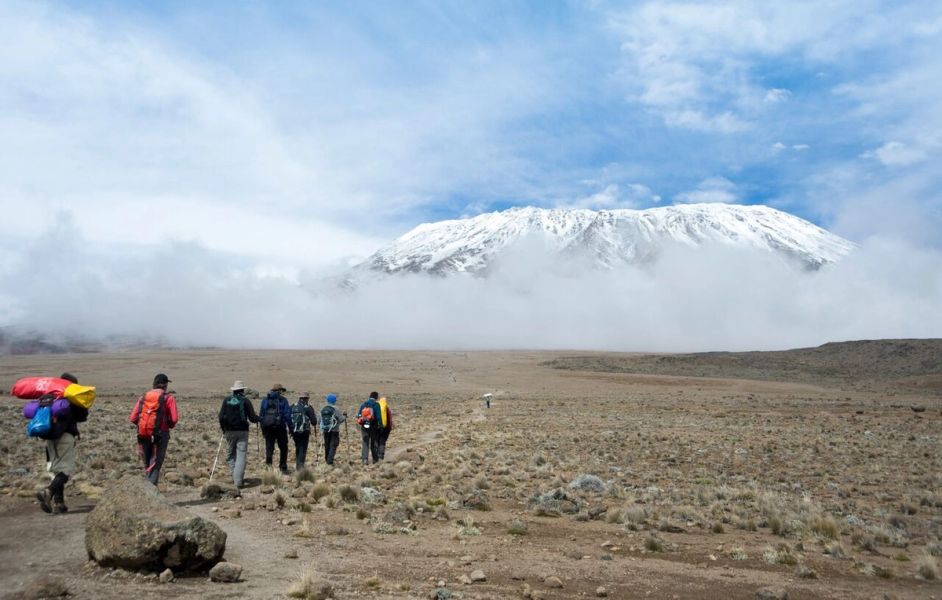Hiking through alpine desert towards Kilimanjaro peak