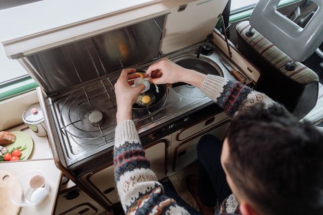 cooking in a converted van camper
