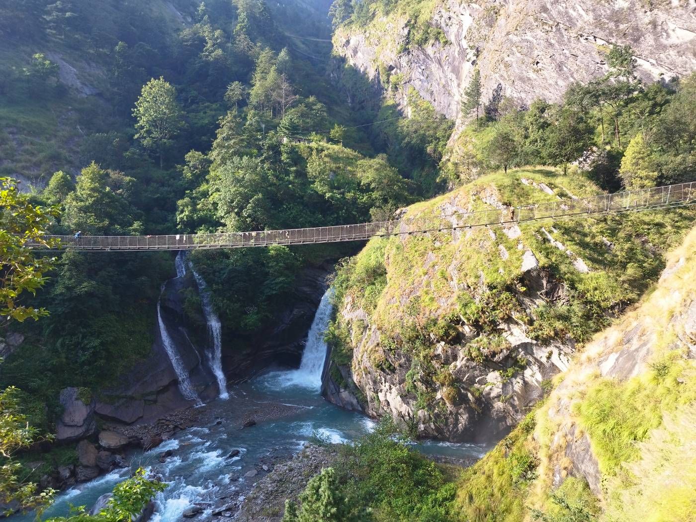 Waterfall beside the Manaslu Circuit trail on the lower valley approach
