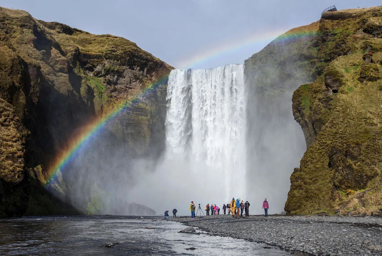 Laugavegur - group hiking landscape waterfalls and rainbows