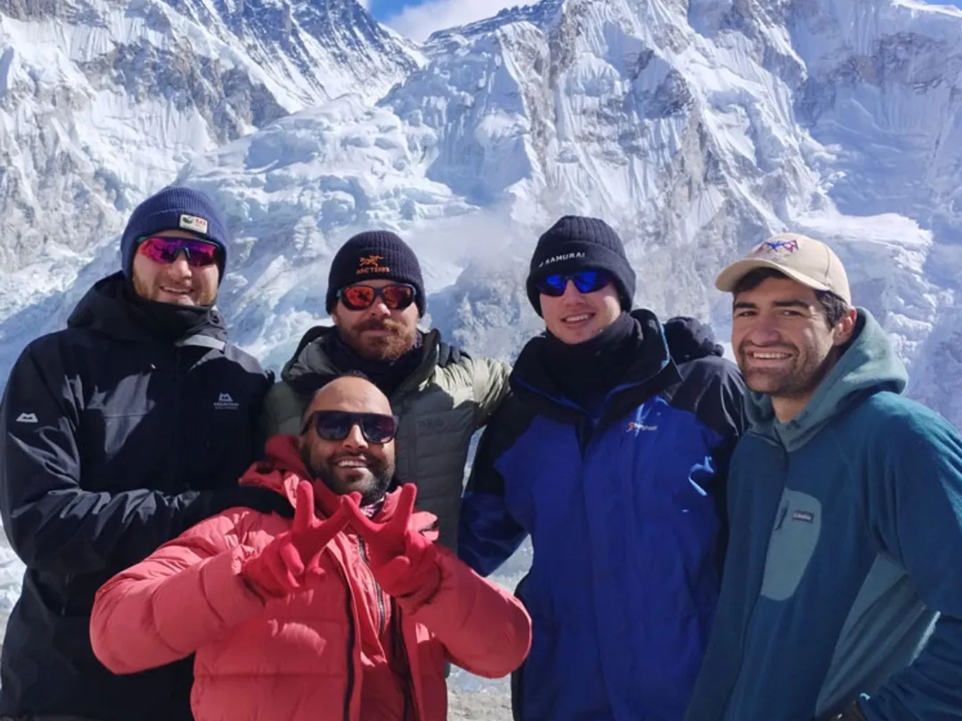 group on Everest Base Camp with mountain view