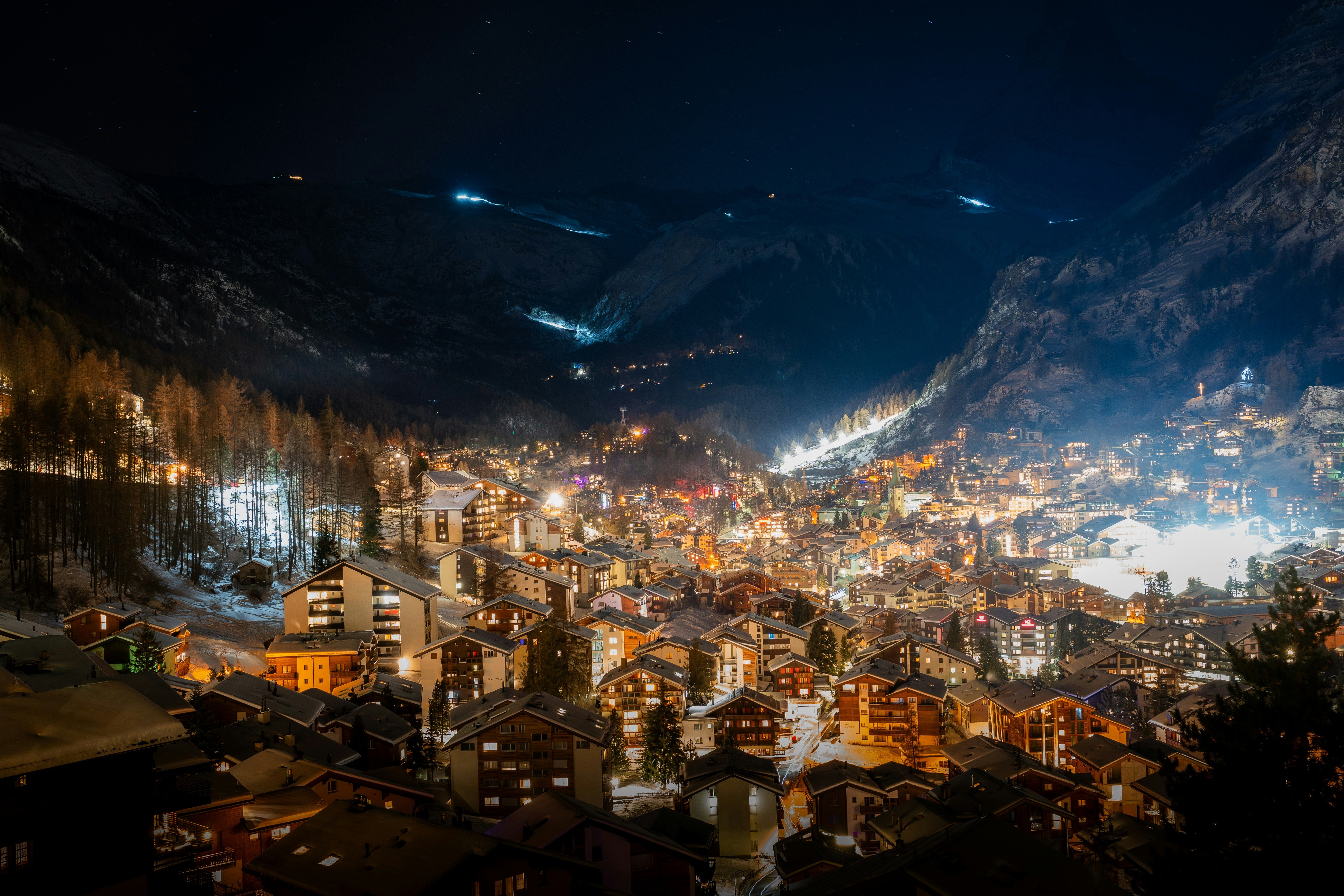 Zermatt village illuminated at night with mountains rising behind
