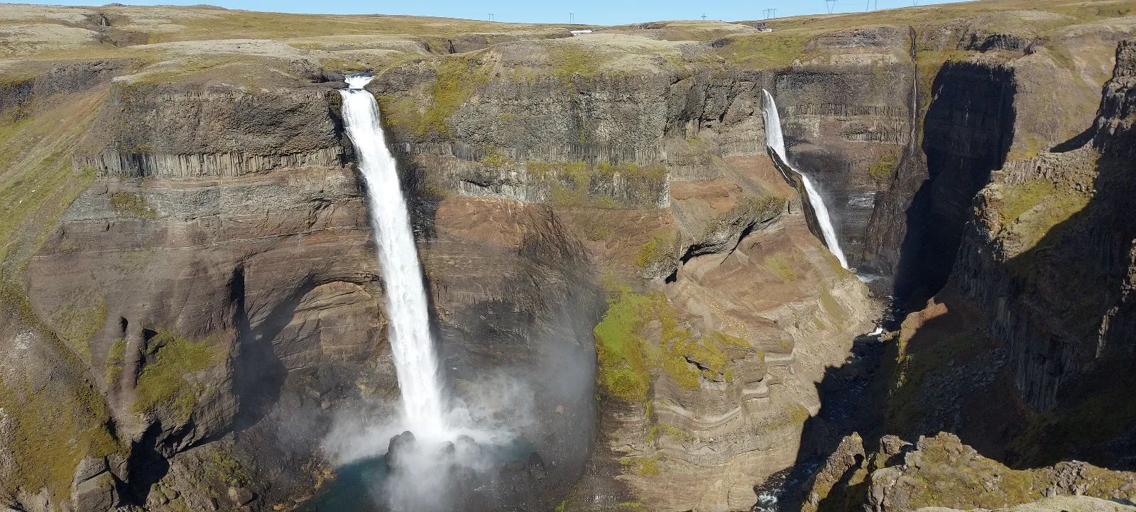 Waterfalls flowing through dramatic Icelandic landscape