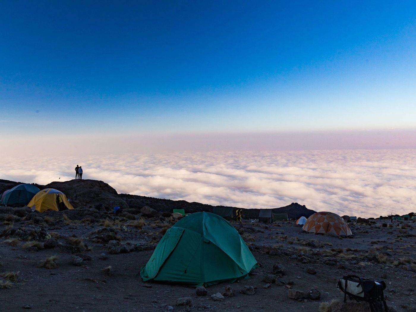 Tent place with couple looking at cloud view
