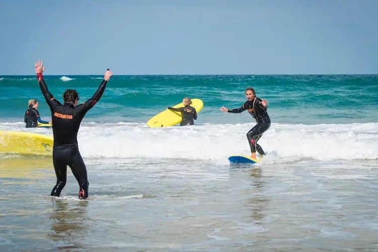Surf lesson standing up on surfboard