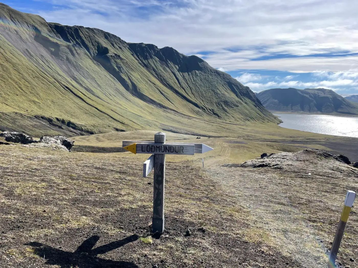 Highland landscape with signpost marking Löðmundur trail