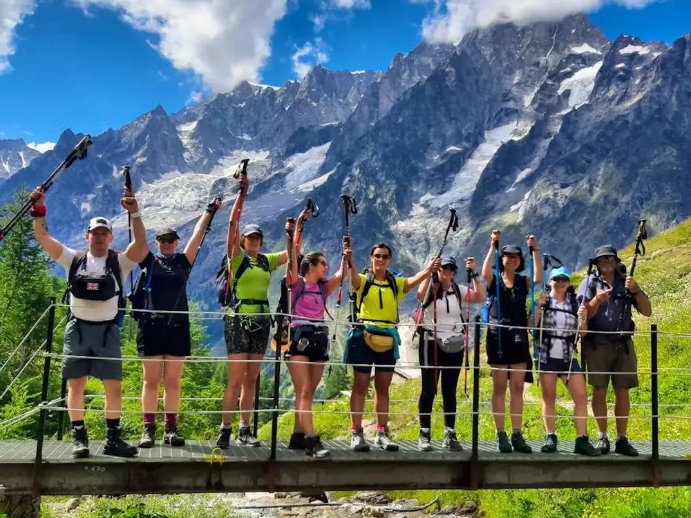 Tour du Mont Blanc Highlights - Group Celebrating On A Bridge