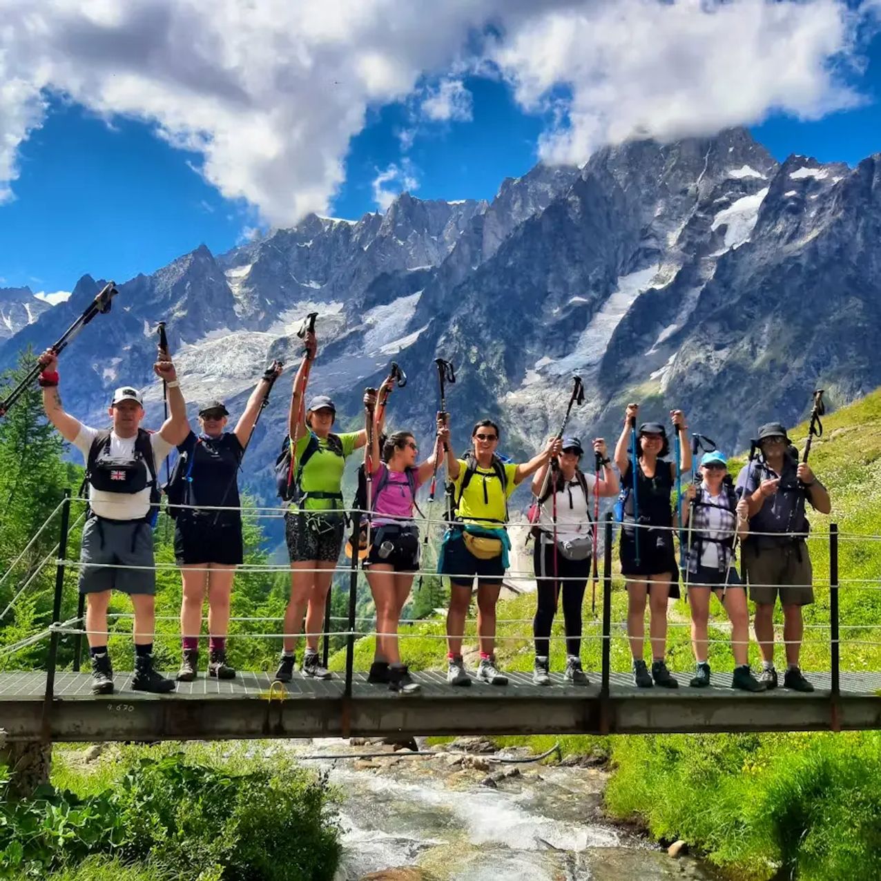 Tour du Mont Blanc Highlights - Group Celebrating On A Bridge