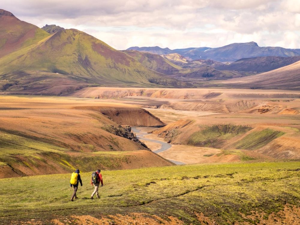 A single hiker on a remote volcanic trail in Iceland's empty highlands