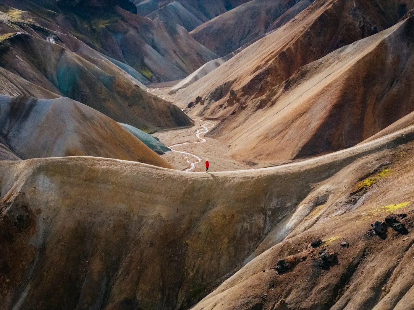 Colorful rhyolite mountains and geothermal landscape in Landmannalaugar with vibrant orange, red and green mineral deposits