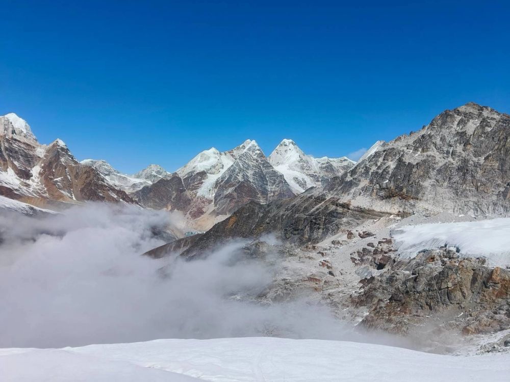 group hiking with clouds as views