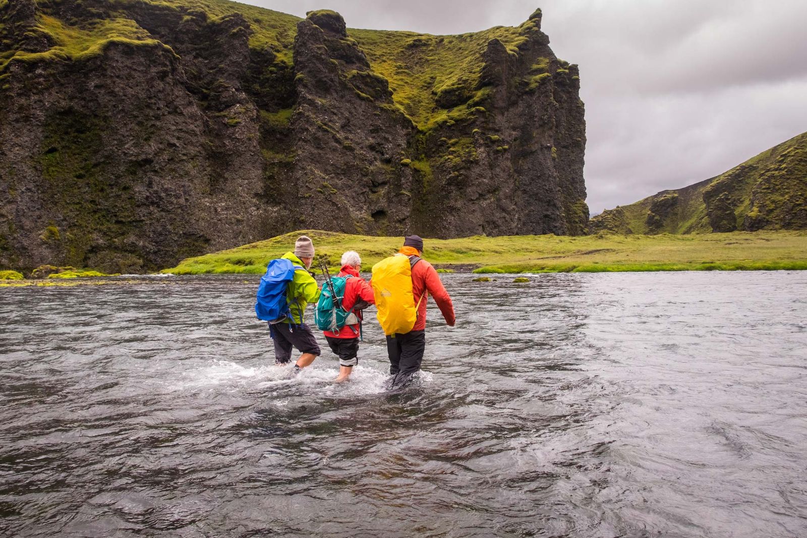 Hiking through river in Iceland