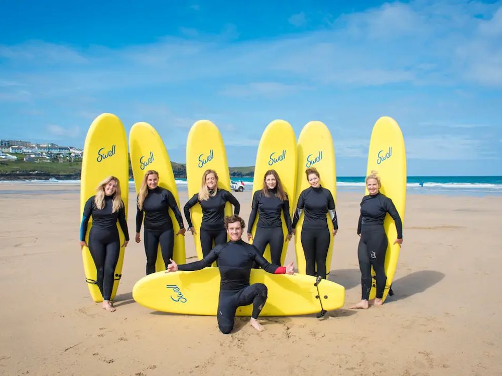 Group photo of people with Surfboards