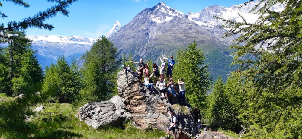 Full group photo with Matterhorn directly behind and blue sky