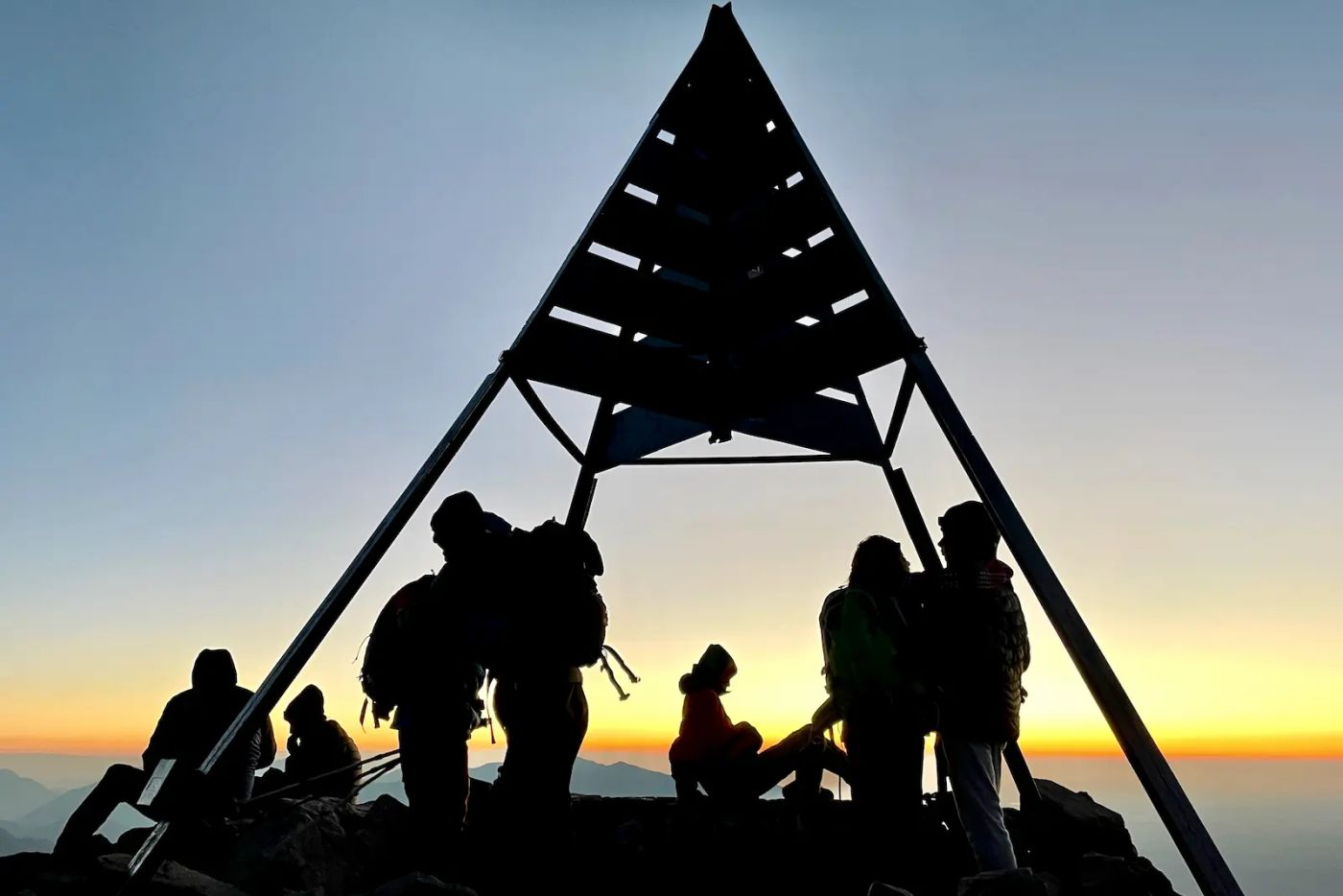 Hikers summit mount toubkal