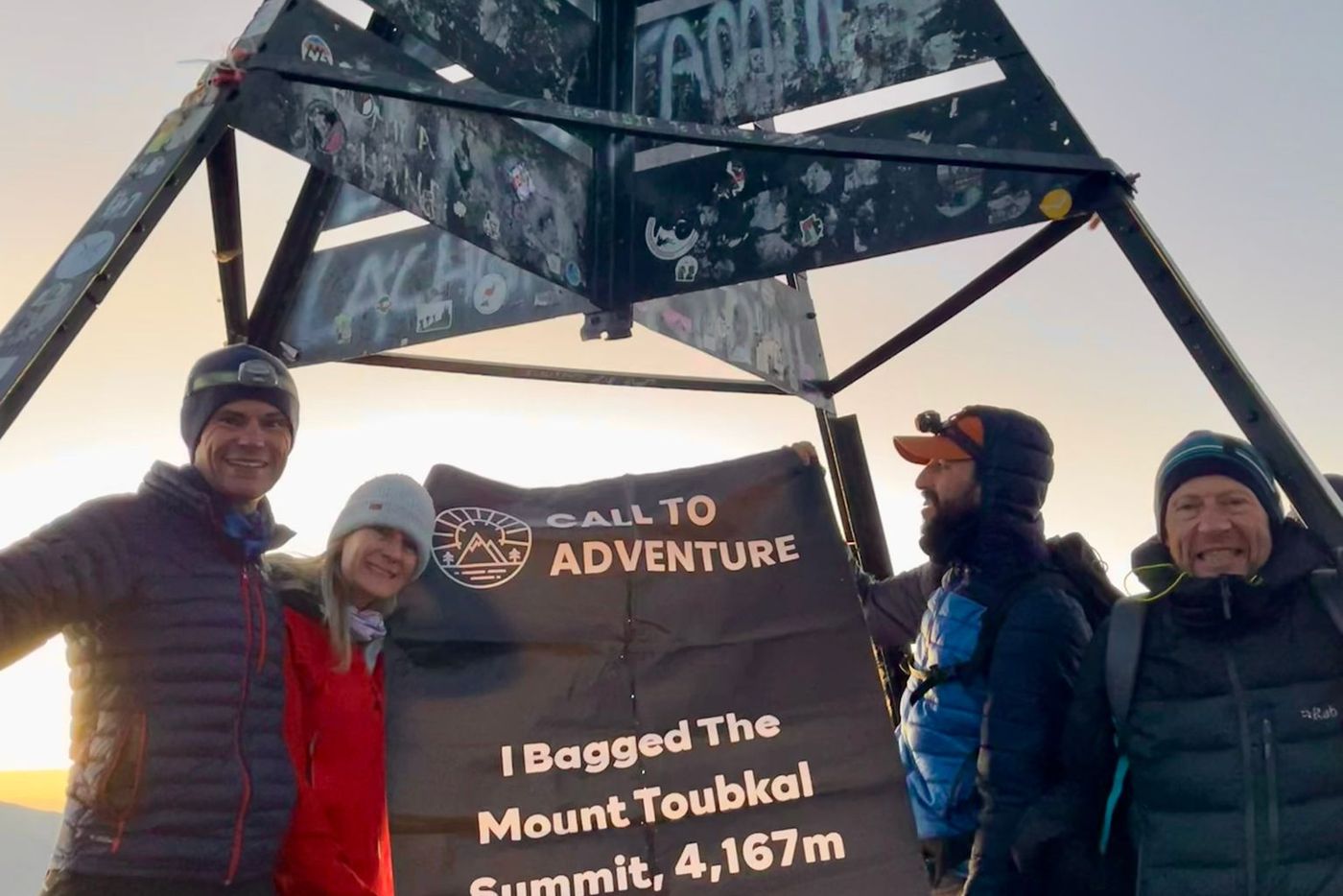 Hikers summit mount toubkal
