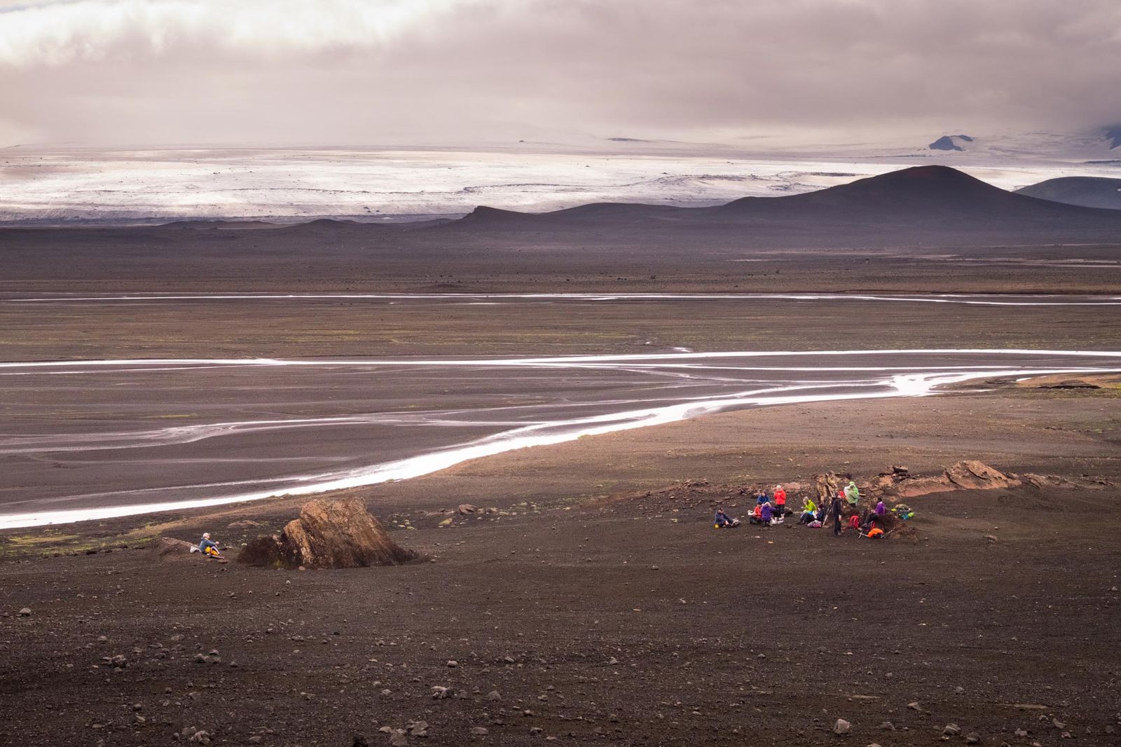 Hiking group in dramatic Icelandic landscape