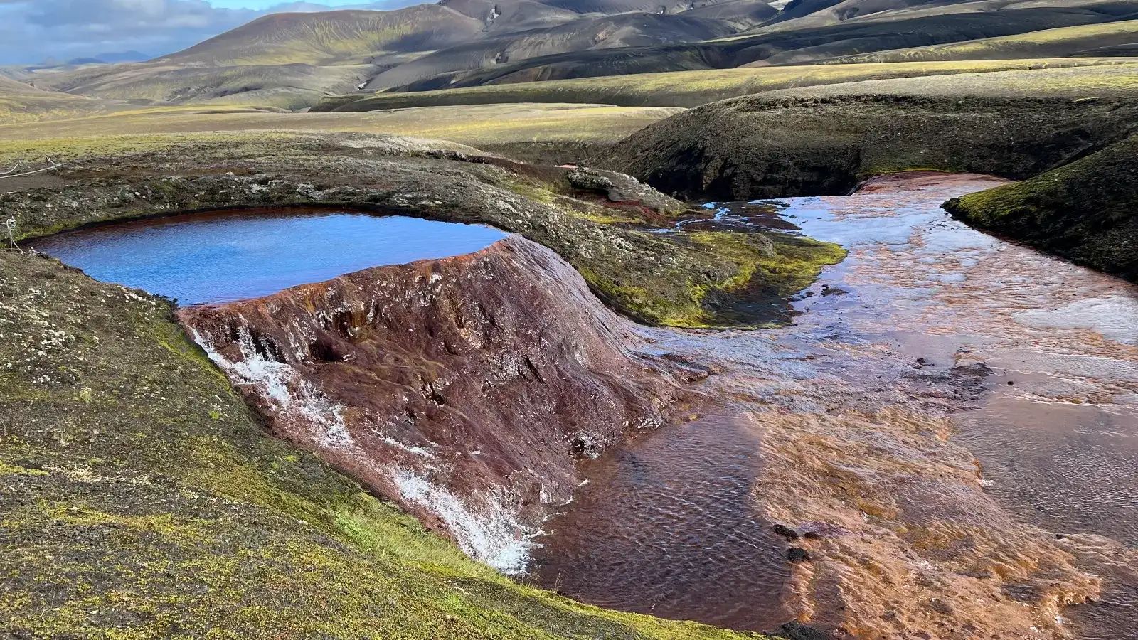 Natural hot spring in geothermal highland landscape