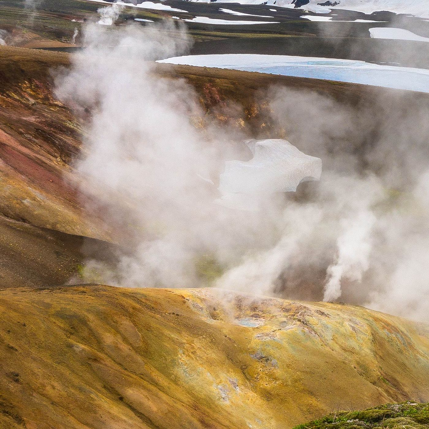 Geothermal volcanic landscape with steam rising