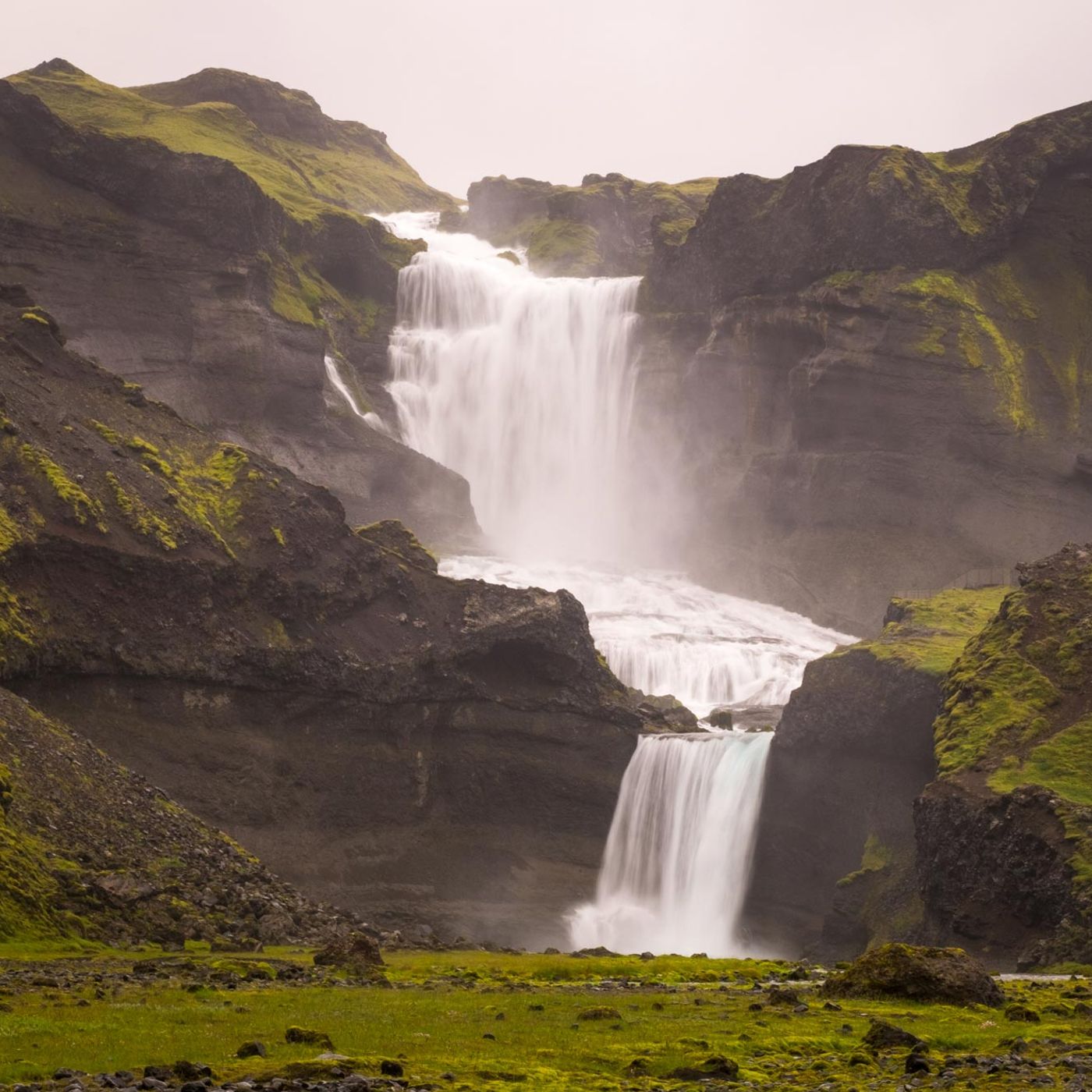 Powerful waterfall cascading through volcanic canyon in Iceland's highlands