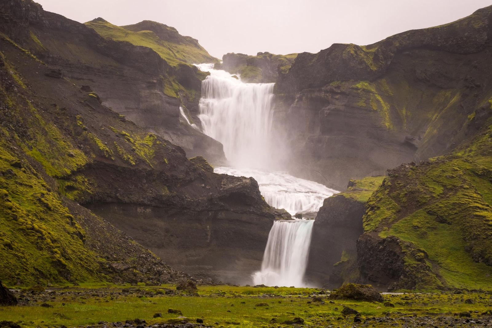 Icelandic waterfall in volcanic landscape
